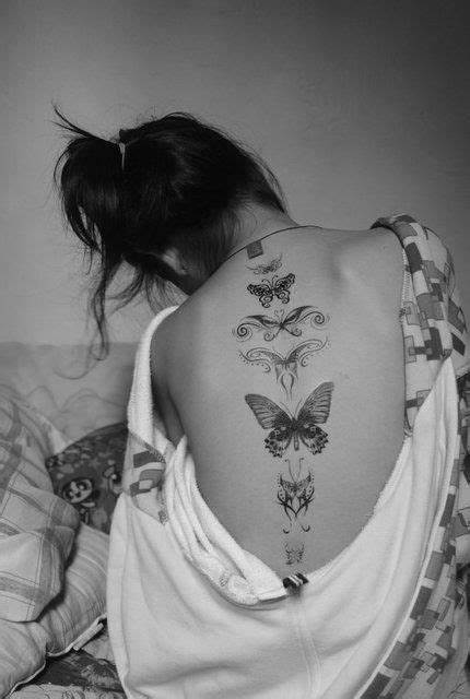 4. Small butterfly spine tattoo