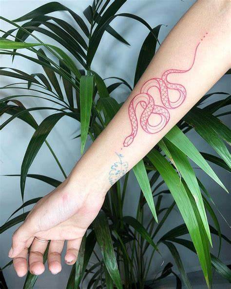 10. Woman's Forearm with a Red Linework Snake Tattoo