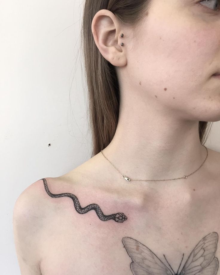 Snake Tattoo in Fine Lines on a Woman's Collarbone