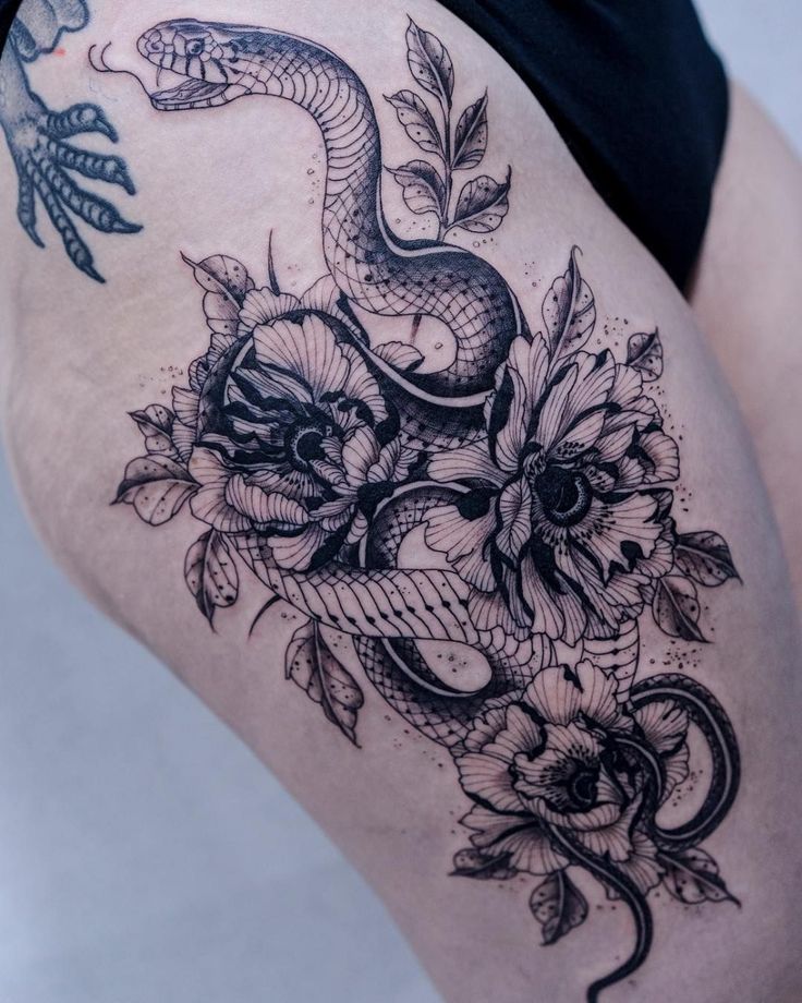 Tattoo of a Floral Snake on a Woman's Ribs