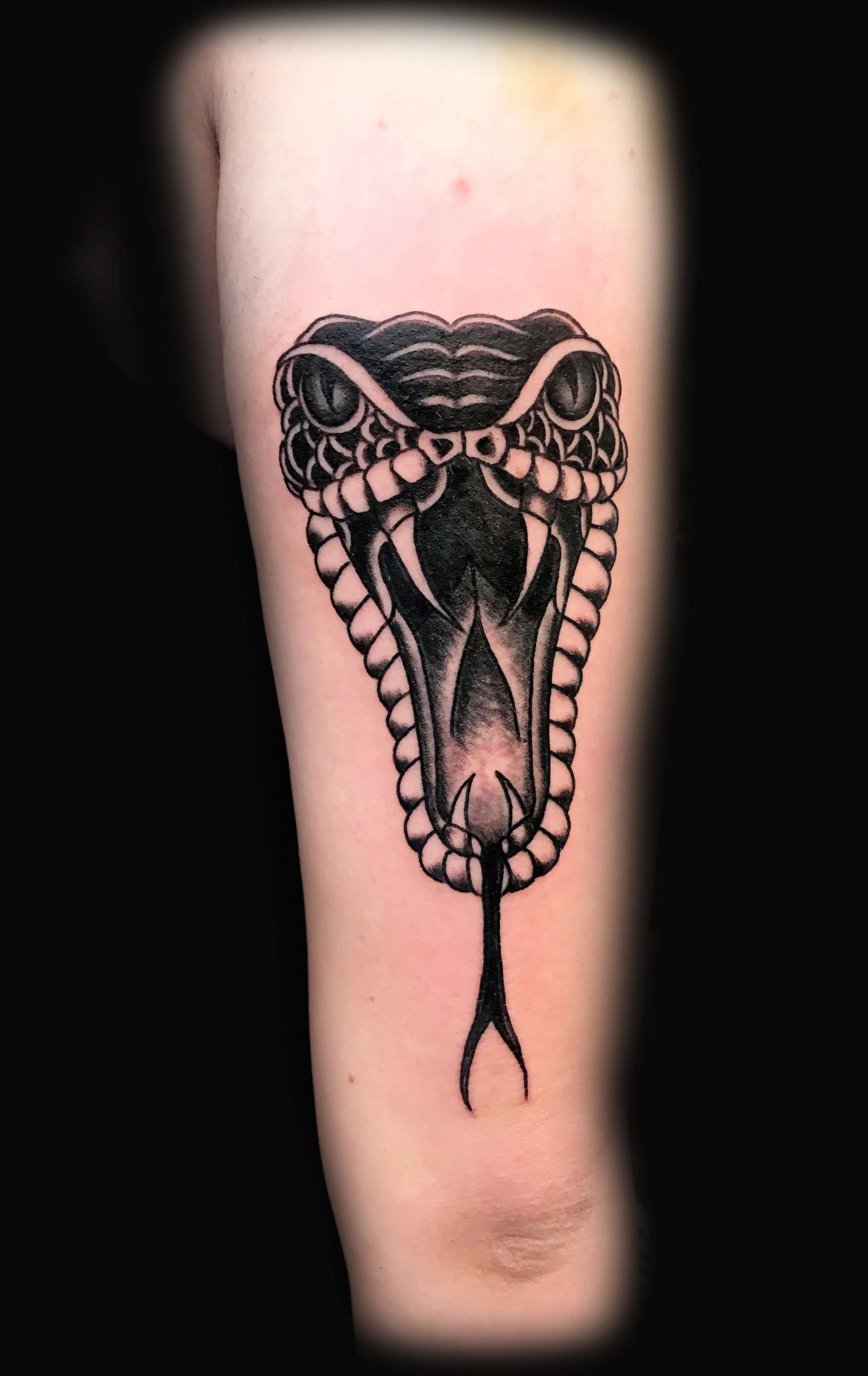 Tattoo with a Snake Head