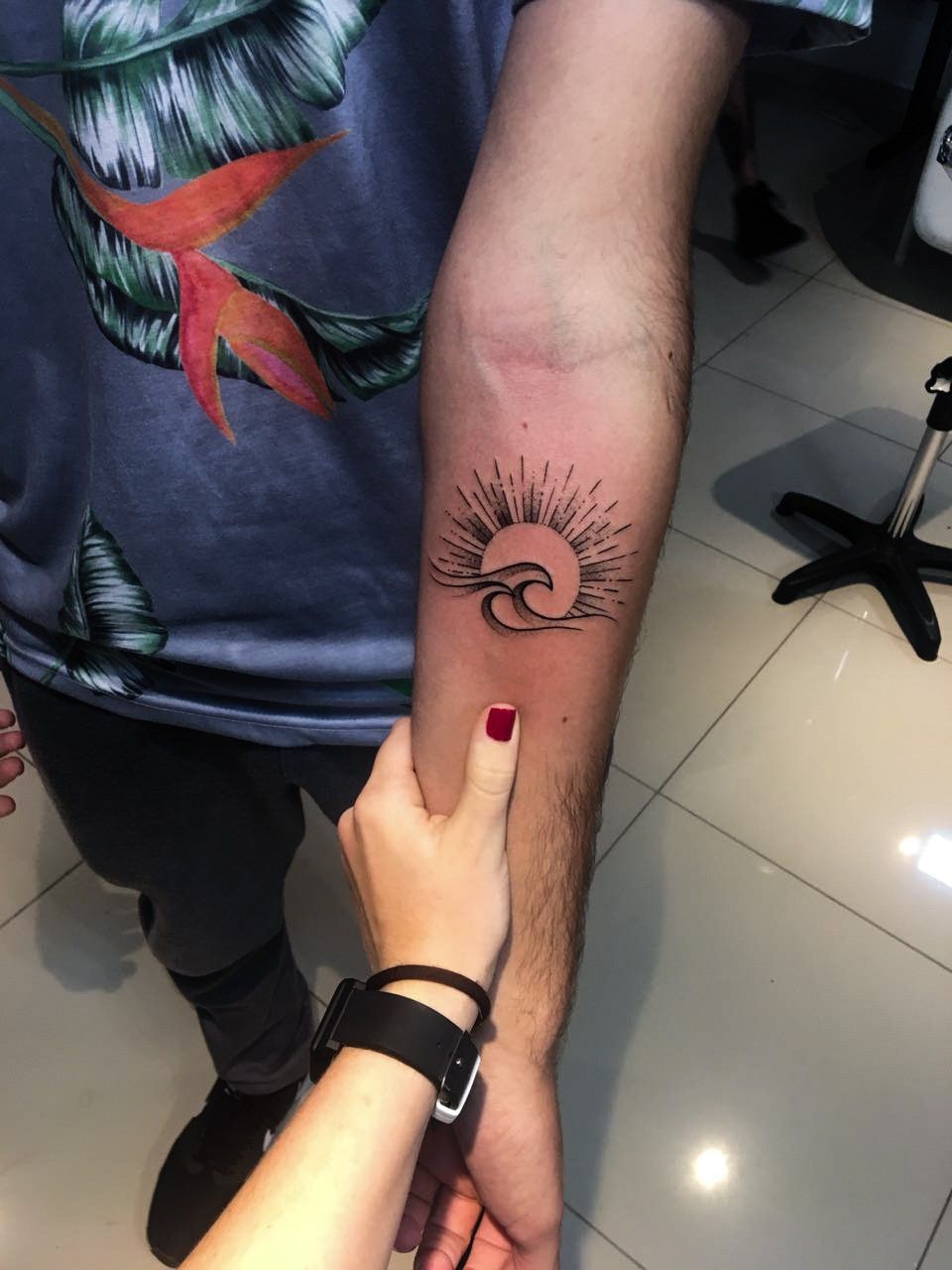 Tattoo with the sun and waves