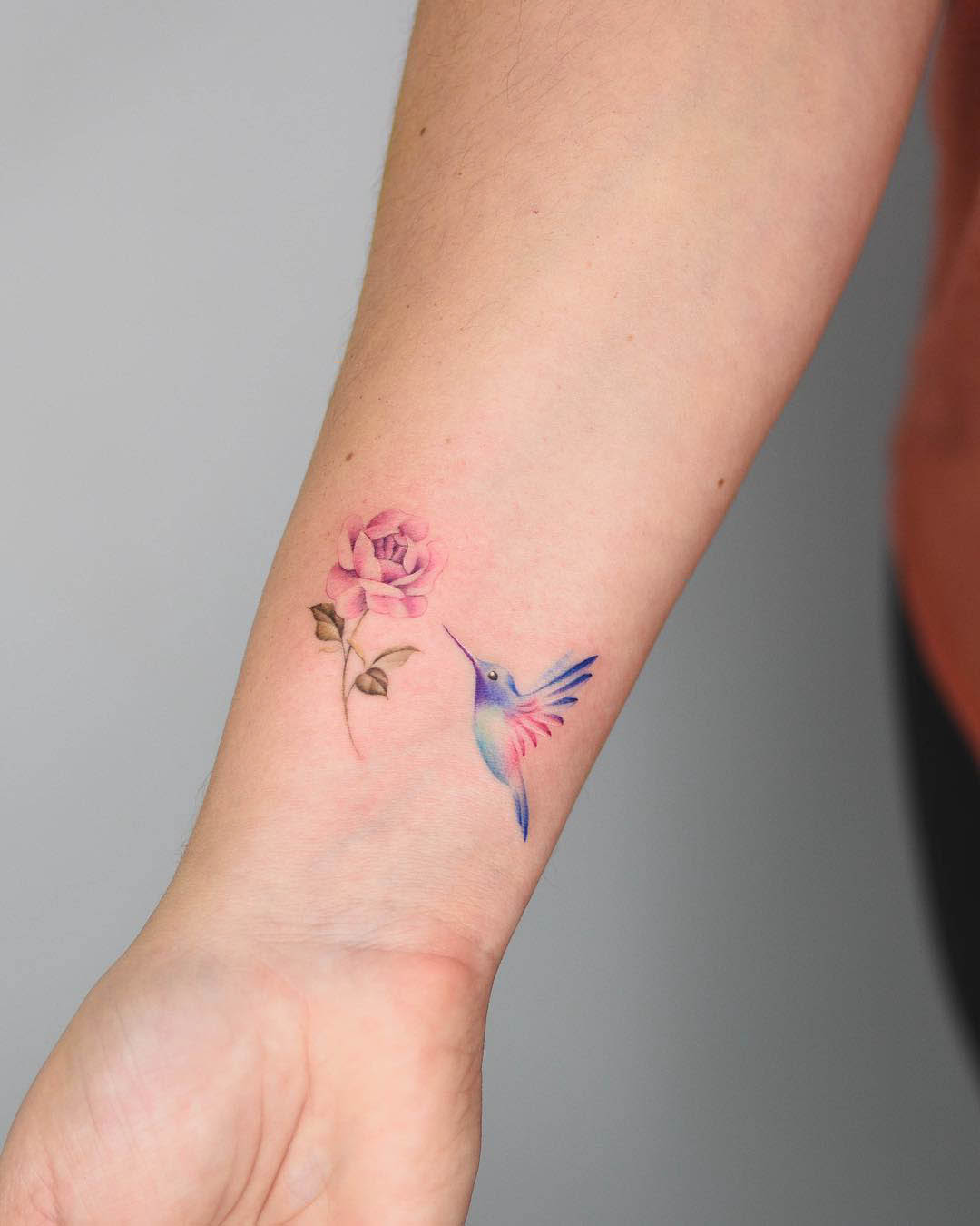 Tattoo of a Hummingbird, Rose, and Flower