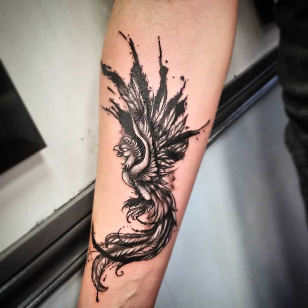 16. Ink splotch Phoenix Tattoo