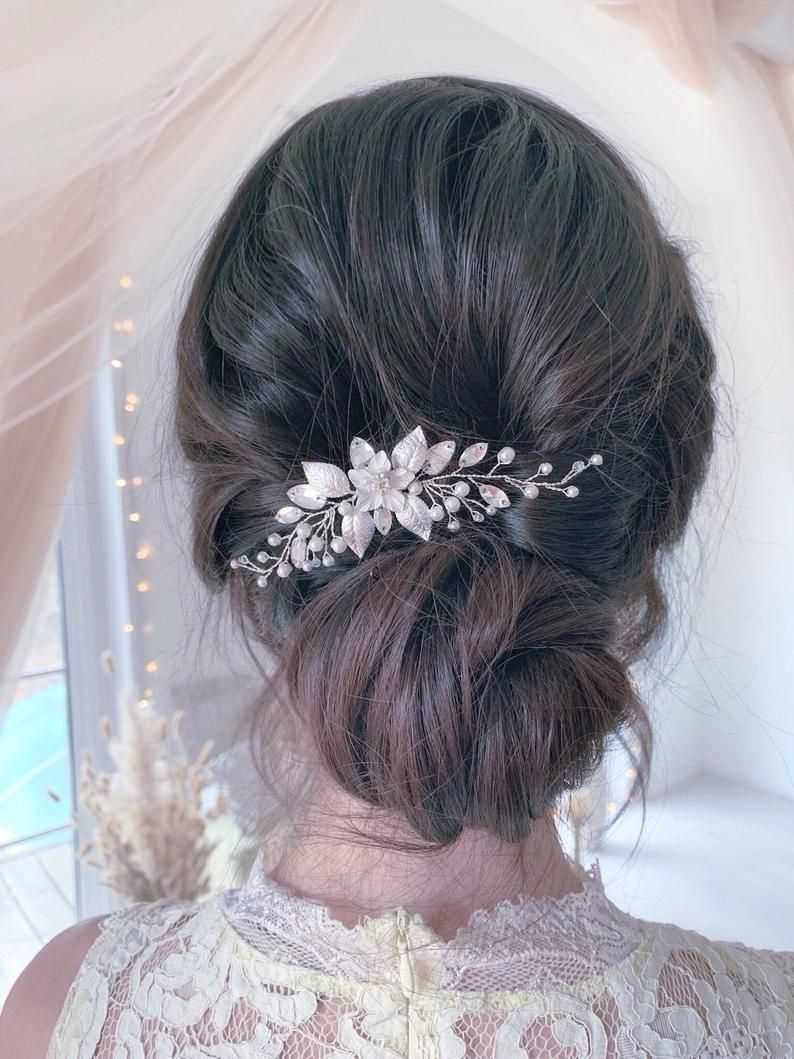 Loose Bun with Embellished Pins Hairstyle For Prom