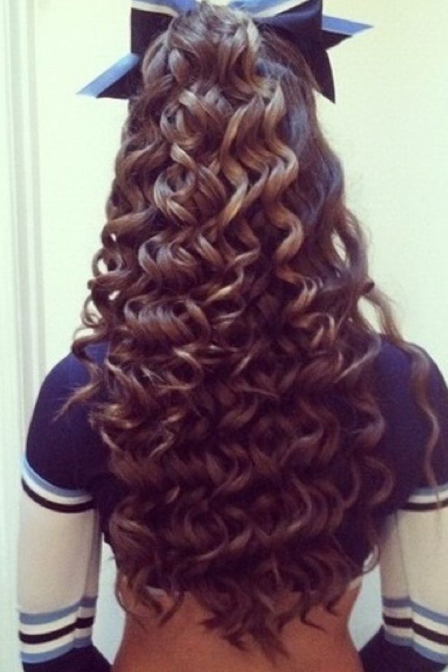 Half-Up Long Curly Hair With A Bow hairstyle for cheerleading