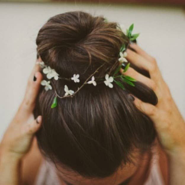 High Bun with Floral Accents for Masquerade Ball