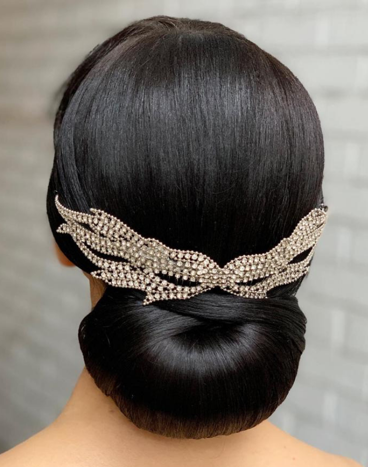 Sleek Chignon with a Statement Hairpin for Masquerade Ball